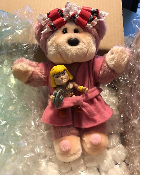 A Tootsie Roll Teddy Bear with a He-Man vinyl figure, from The Wizard's Nightshirt Podcast.